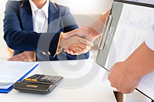 Good deal. Close-up of beautiful women business people shaking hands whileÂ successfulÂ job interview or Job applicant in modern